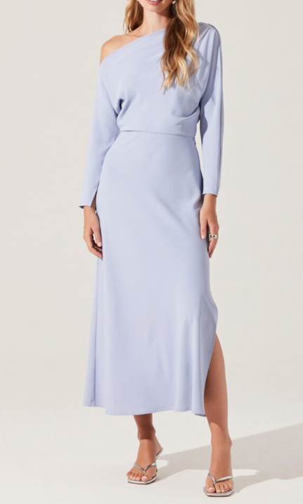 A woman modeling the cool blue Naidia Dress.